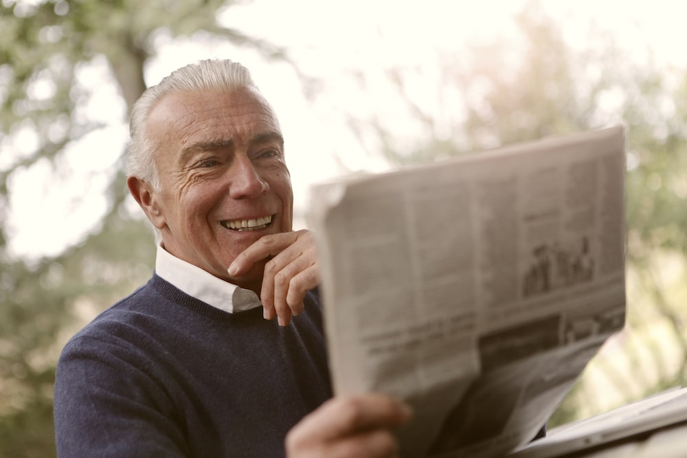 A person is reading newspaper